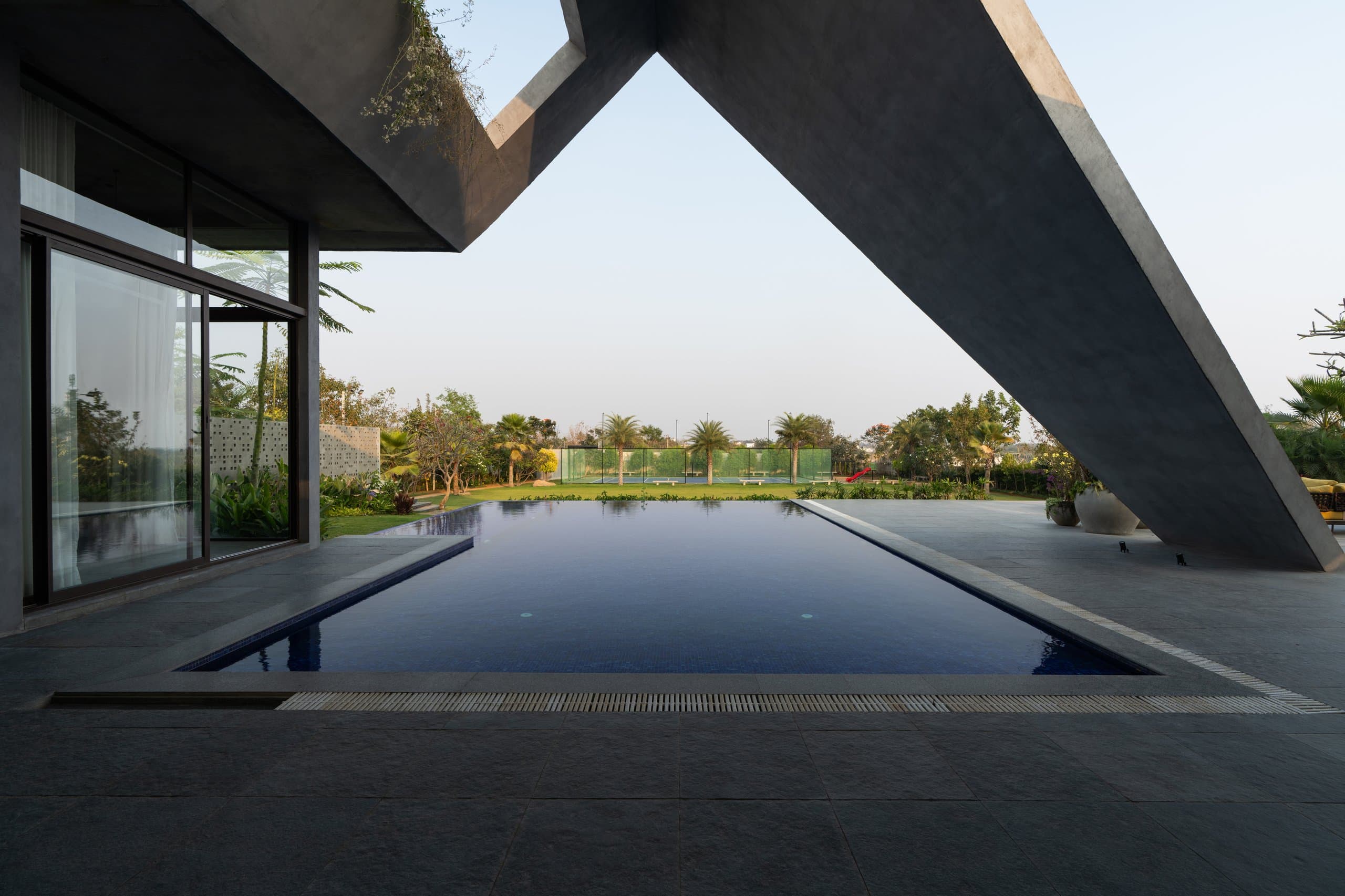 Beautiful lush lawn and swimming pool area at SAHN